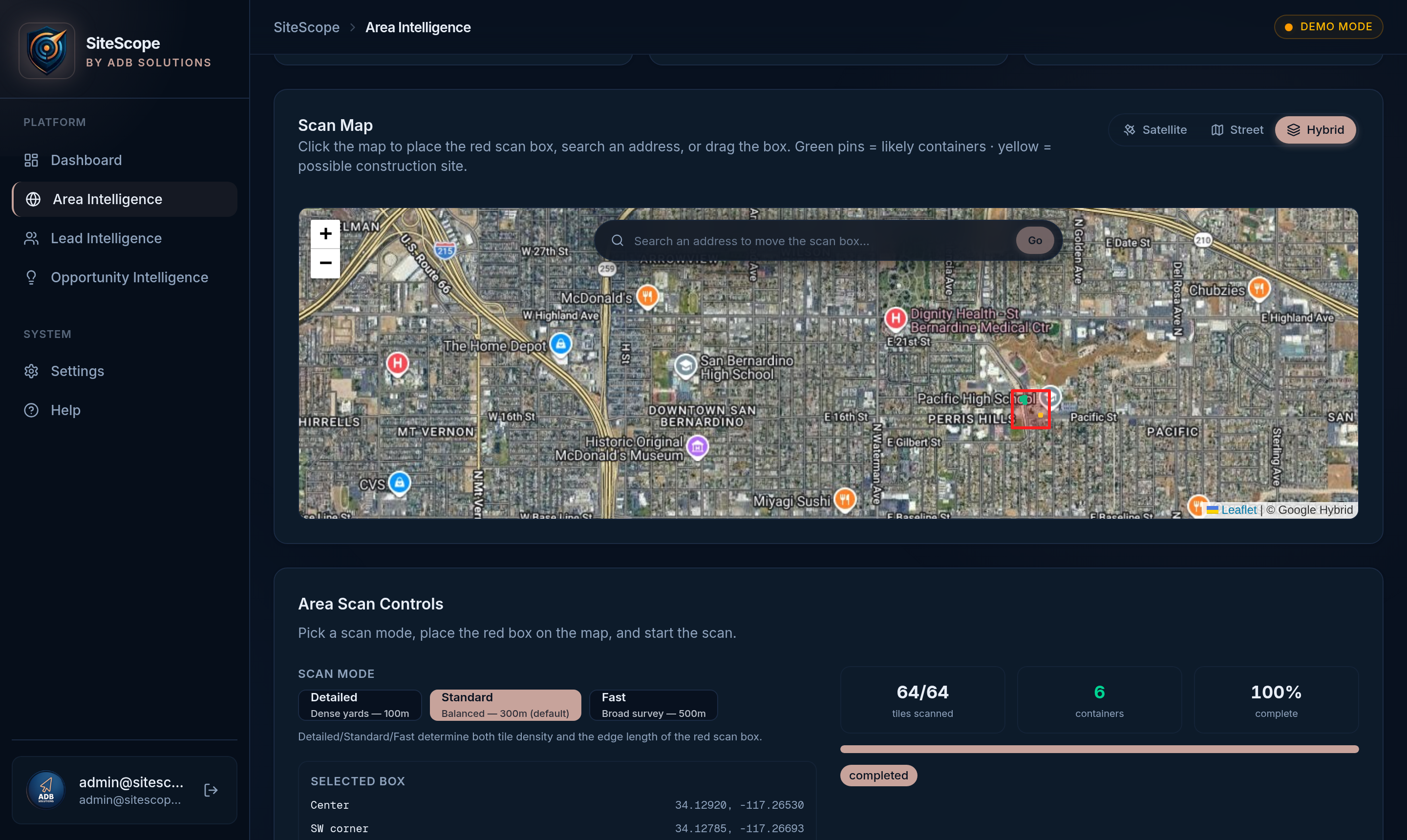 SiteScope detection on aerial imagery — green bounding box marks shipping containers, yellow box marks possible construction activity